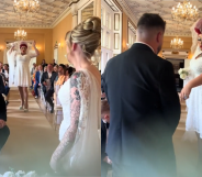 The drag bride tried to snatch away the husband-to-be. (@mwhitephotograph/TikTok)