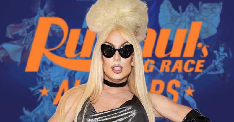 Alaska in front of the promo for All Stars 9