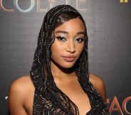 Amandla Stenberg wears a black lacy head covering while on the red carpet premiere of Star Wars: The Acolyte.