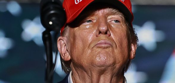 Donald Trump, pictured in a red hat.