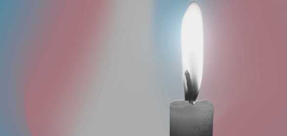 a candle with a trans hue