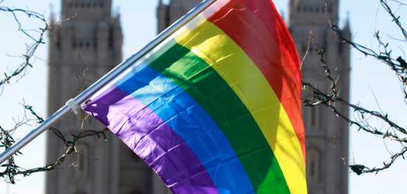 Mormon church with LGBTQ flag in front