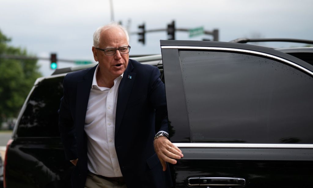 Tim Walz, pictured, exiting a vehicle.
