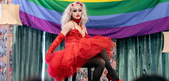 Latin drag queen from bogota Colombia between 30 and 39 years old, presents her theatrical work to her followers during the performance inside the theater on the day of gay pride