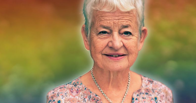 A photoshopped picture of Jacqueline Wilson infront of a rainbow background.