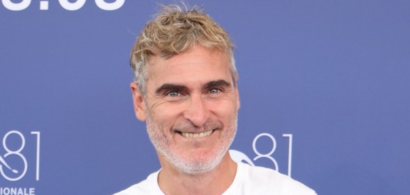 Joaquin Phoenix smiling during the press shoot at Venice Film Festival