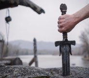 famous sword excalibur of King Arthur stuck in the rock. Edged weapons from the legend Pro king Arthur.