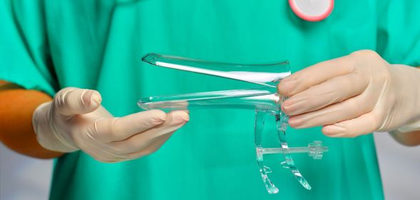 Stock image of a doctor holding a speculum to illustrate article on smear test
