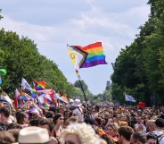 Progress inclusive Pride Flag flying at a parade