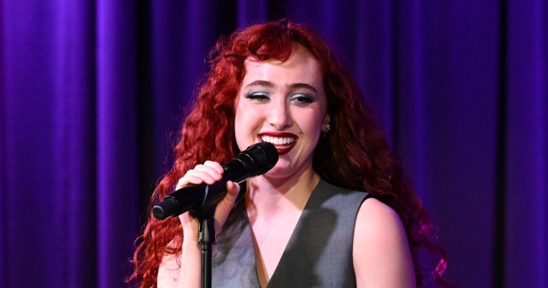 Chappell Roan at Spotlight: A Night with Chappell Roan and Daniel Nigro at The Grammy Museum. Wearing a grey suit.