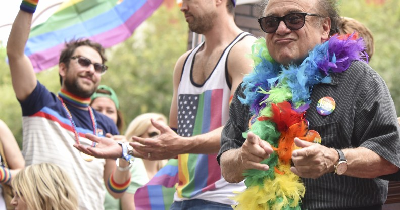 Danny Devito wearing a feather boa at 2016 LA Pride