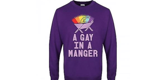 A purple Christmas jumper with a rainbow over a crib and the text &#039;a gay in a manger&#039; from Debenhams