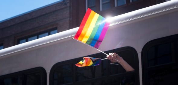 Pride flag waving out of a bus in Oregon