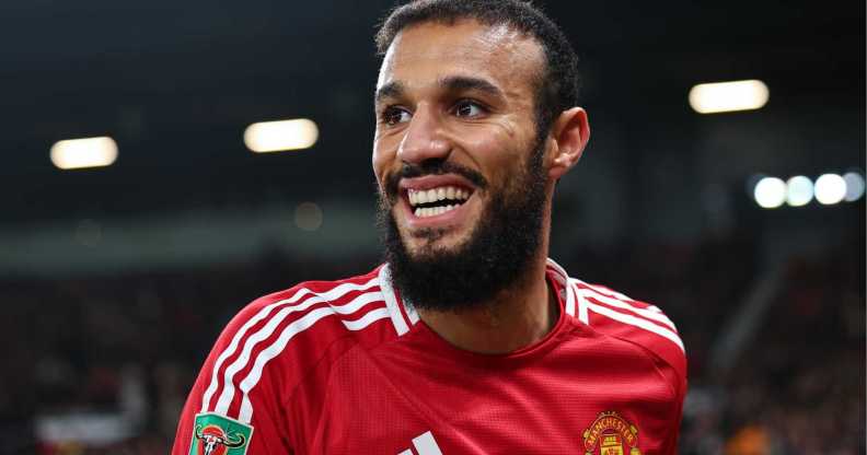 Noussair Mazraoui of Manchester United smiling.