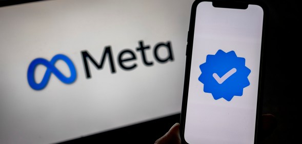 SANTA ROSA, PHILIPPINES - JANUARY 08: In this photo illustration, the Meta logo and its verified logo are seen on screens on January 08, 2025 in Santa Rosa, Philippines. Meta has announced the discontinuation of its fact-checking program, transitioning to a community-driven model that relies on users to add context to potentially misleading posts, a move aimed at promoting free expression. This significant policy shift has raised concerns among experts about the potential increase in misinformation and hate speech on Meta's platforms, including Facebook and Instagram, as the company prepares for a new political landscape under the upcoming Trump presidency. (Photo illustration by Ezra Acayan/Getty Images)