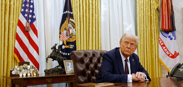 Donald Trump signing executive orders.