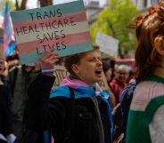 Protestors holding signs that read "trans healthcare saves lives."