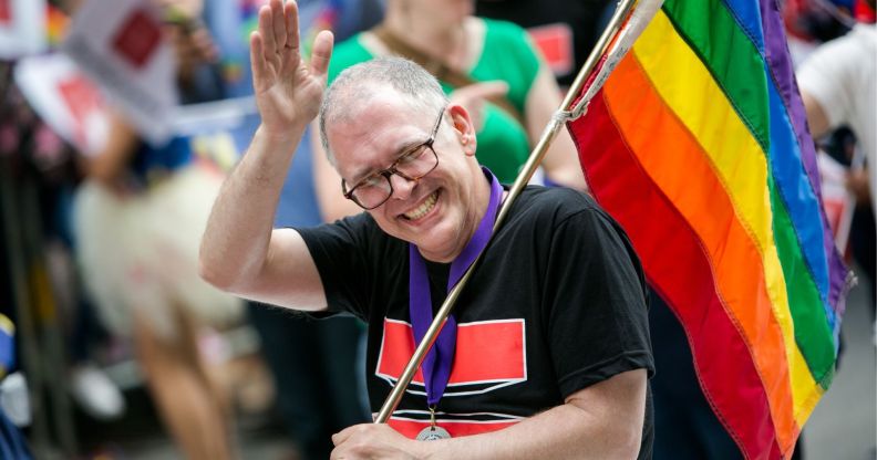 Jim Obergefell, the man who took his fight for equal marriage to the US Supreme Court in 2015, with a rainbow Pride flag