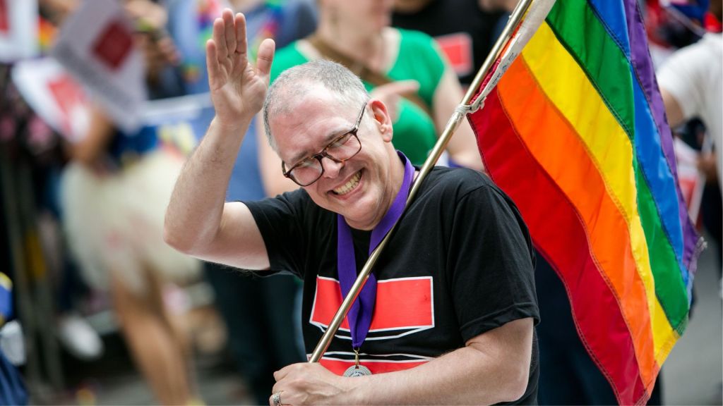 Jim Obergefell, the man who took his fight for equal marriage to the US Supreme Court in 2015, with a rainbow Pride flag