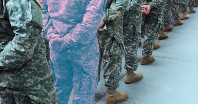 A military line-up, with one soldier in the trans colours.