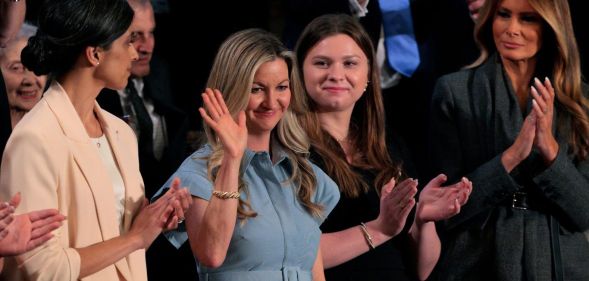 January Littlejohn (2-R) reacts as Second Lady Usha Vance (L) and First Lady Melania Trump (R) look on during US President Donald Trump's address to a joint session of Congress at the U.S. Capitol.