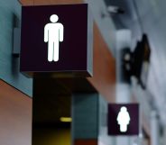 Two bathroom stall signs.