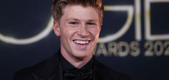 A close up shot of Robert Irwin smiling at the camera