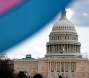 The U.S. Capitol Building is seen behind the Transgender Pride Flag during the Trans Day Of Visibility rally.