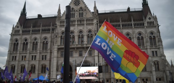 LGBTQ+ flag is at a rally in front of the Hungarian Parliament in Budapest, Hungary.