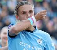 Kerstin Casparij of Manchester City kisses her wrist as she celebrates scoring her team's first goal during the Barclays Women's Super League match between Manchester City FC and Everton FC at Joie Stadium.