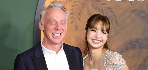 The White Lotus creator Mike White and star Lisa smile at the red carpet premiere of The White Lotus season three.