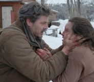 Pedro Pascal as Joel and Bella Ramsey as Ellie in The Last of Us. Joel is clutching Ellie's face which is bleeding. They both look in shock.