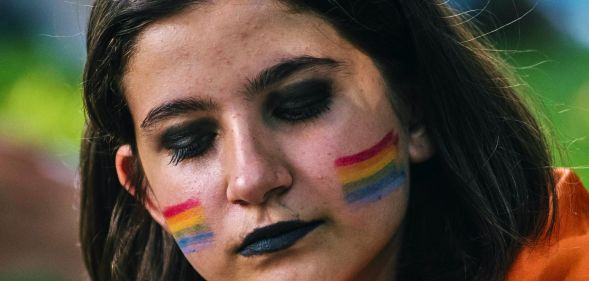 A person applying make-up.