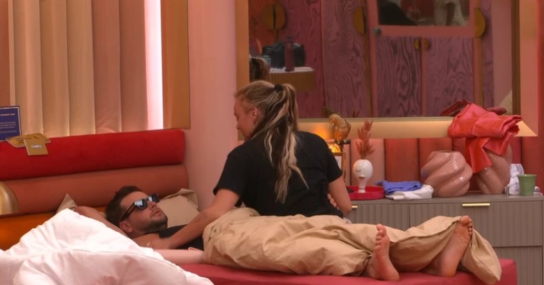 JoJo Siwa pictured sitting on a bed with Chris Hughes