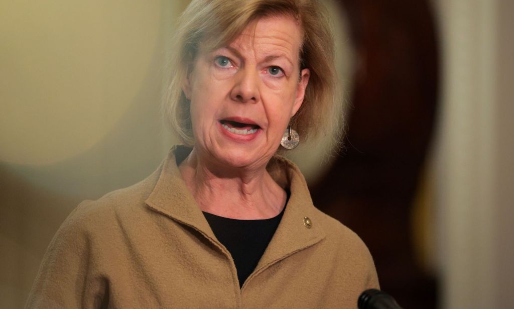 Tammy Baldwin speaking at a podium.