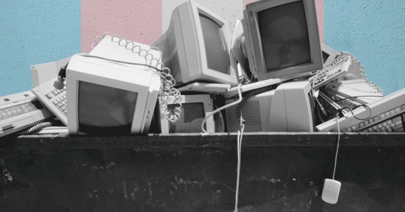 A pile of computer parts in a skip.