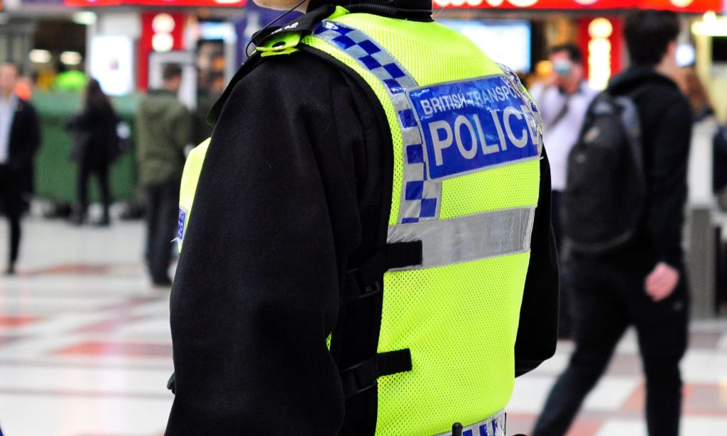 A member of the British Transport Police in a train station