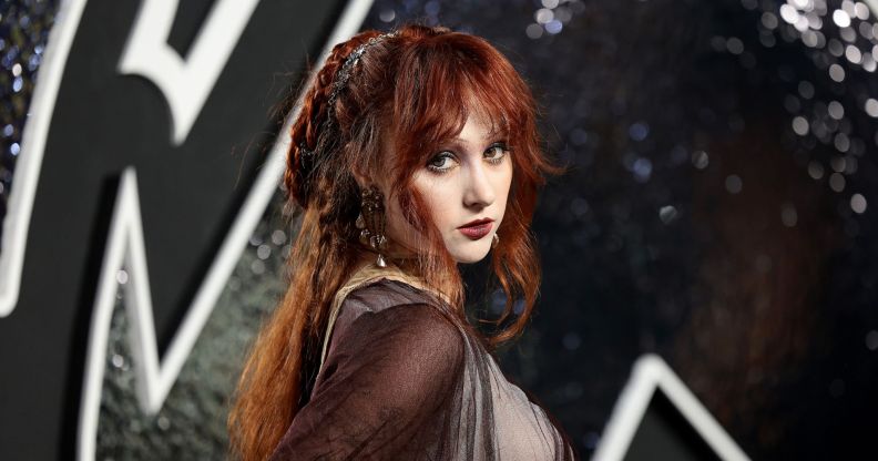 Chappell Roan on the red carpet at the 2024 VMA awards in a sheer black and silver dress.