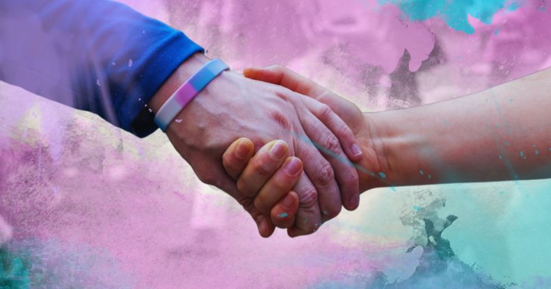 Two people holding hands.