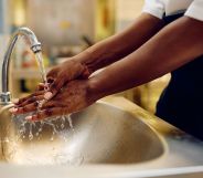 A person washing their hands.