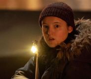 Bella Ramsey looking shocked while in character as Ellie in The Last of Us.