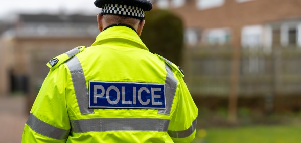 A policeman walking away.