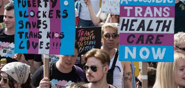 Protesters carry placards against the ban on puberty blockers and for accessible trans healthcare as transgender people and their supporters march through central London during the sixth Trans Pride protest march for transgender freedom and equality in the UK and globally in London, United Kingdom on July 27, 2024.