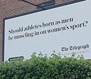 A billboard from the Telegraph which reads: "Should athletes born as men be muscling in on women's sports?"