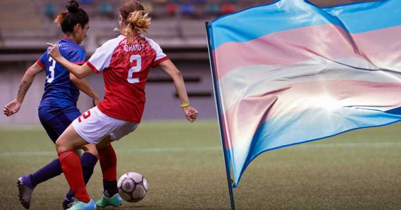 A still photograph of a female soccer defender in a blue uniform dribbling a soccer ball while an opposing attacker attempts to gain possession of the ball.