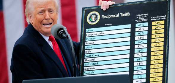 WASHINGTON, DC - APRIL 02: U.S. President Donald Trump holds up a chart while speaking during a “Make America Wealthy Again” trade announcement event in the Rose Garden at the White House on April 2, 2025 in Washington, DC. Touting the event as “Liberation Day”, Trump is expected to announce additional tariffs targeting goods imported to the U.S. (Photo by Chip Somodevilla/Getty Images)