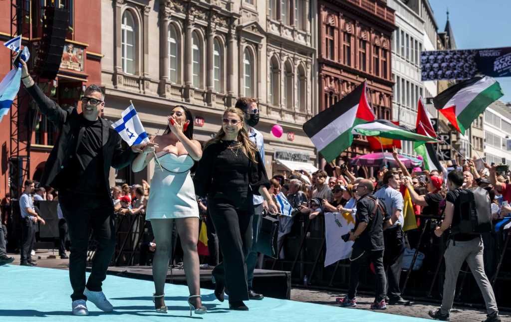 Israeli singer Yuval Raphael representing Israel with the song "New Day Will Rise" walks on the turquoise carpet next to the Basel Town Hall during the opening ceremony of the Eurovision Song Contest 2025 in Basel on May 11, 2025.