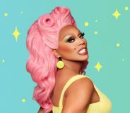 RuPaul smiling while wearing a pink wig and yellow top, stood against a mint background.