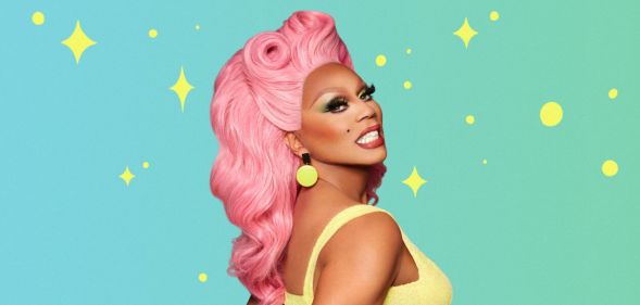 RuPaul smiling while wearing a pink wig and yellow top, stood against a mint background.