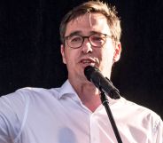 Gergely Karácsony, pictured pointing and speaking into a microphone.